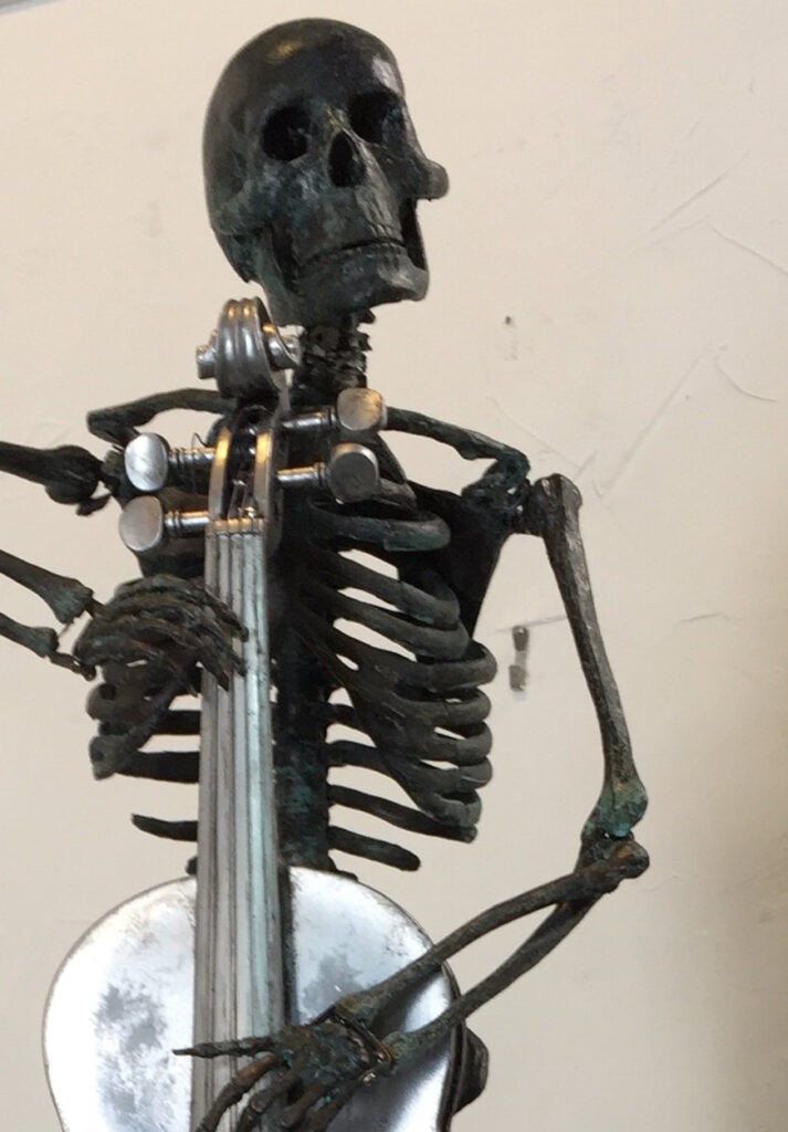 The Cellist on a stump — mixed media